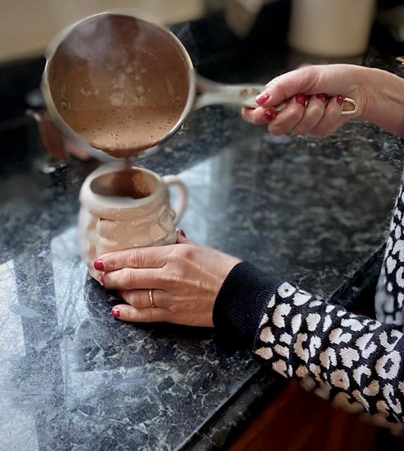 woman preparing a healthy hot chocolate without milk