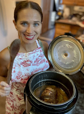 woman making easy slow cooker apple pork loin