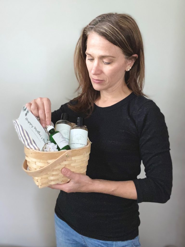 woman holding homemade skincare at the farmhouse