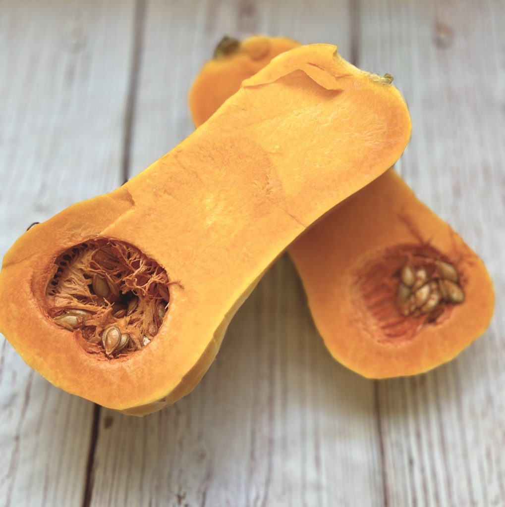 butternut squash cut in half before the seeds are removed
