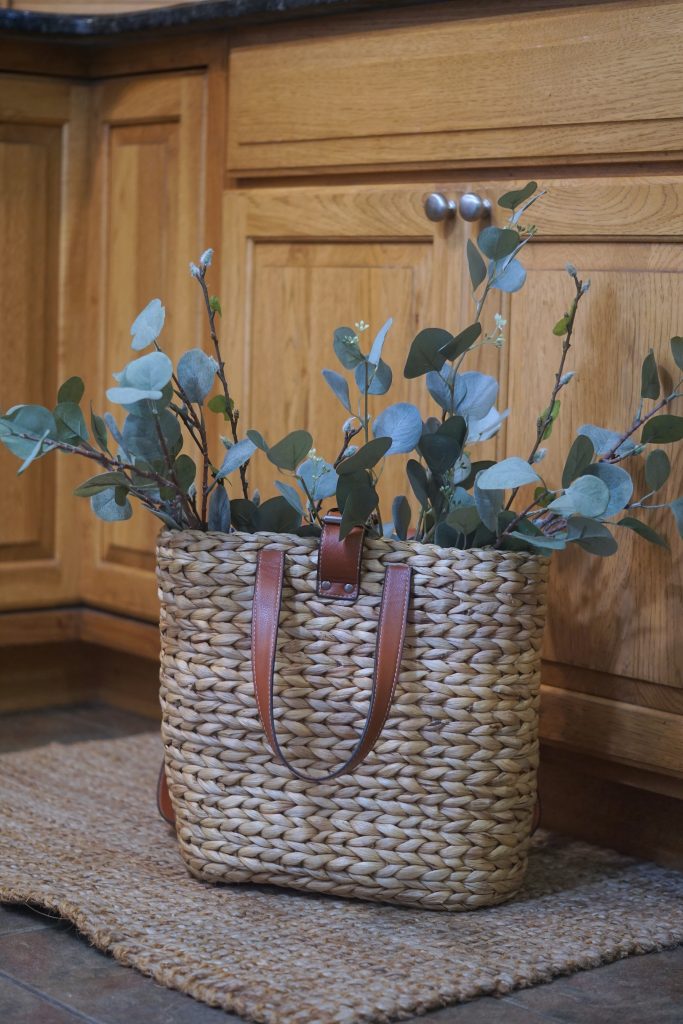 green Eucalyptus in a woven basket