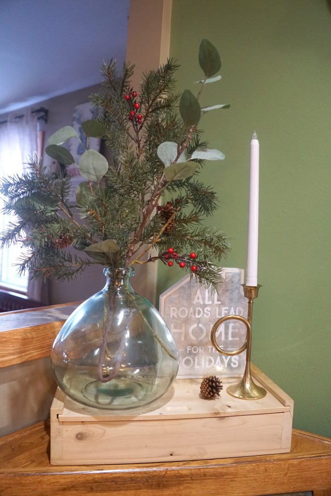 clear vase with pine and eucalyptus