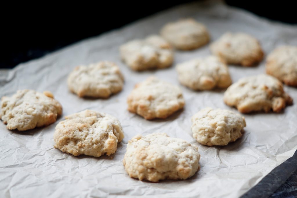 White Chocolate Macadamia Cookies on parchment paper