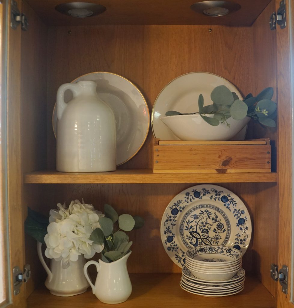 a display of blue and white ironstone dishes