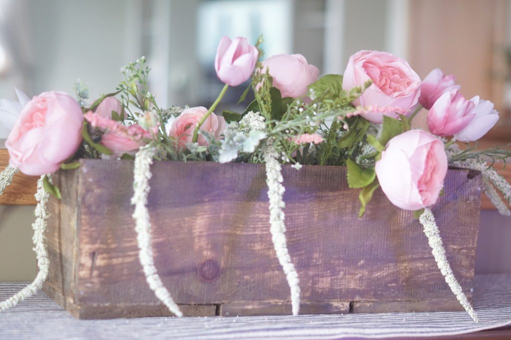 homemade wood pallet flower box with pink peonies and tulips