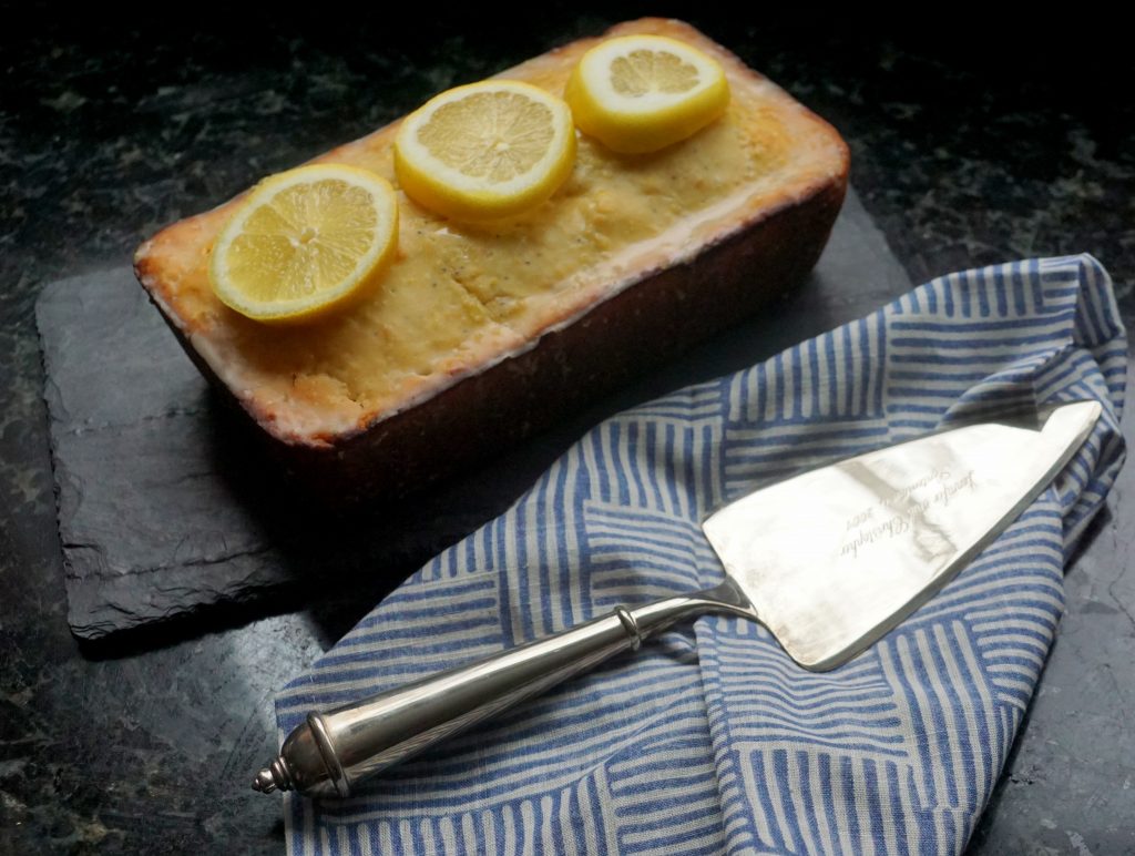 sourdough lemon loaf on a serving platter