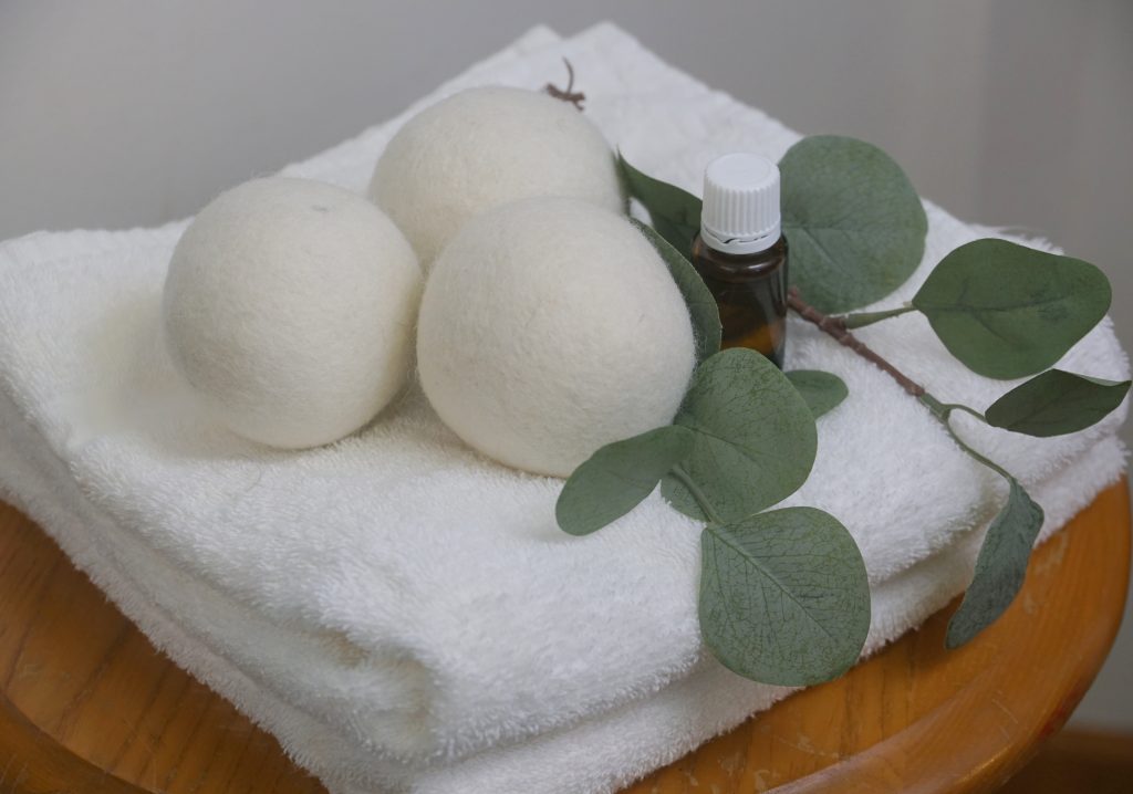 dry bowl and eucalyptus on a white towel