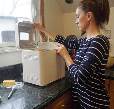 woman using a bread machine