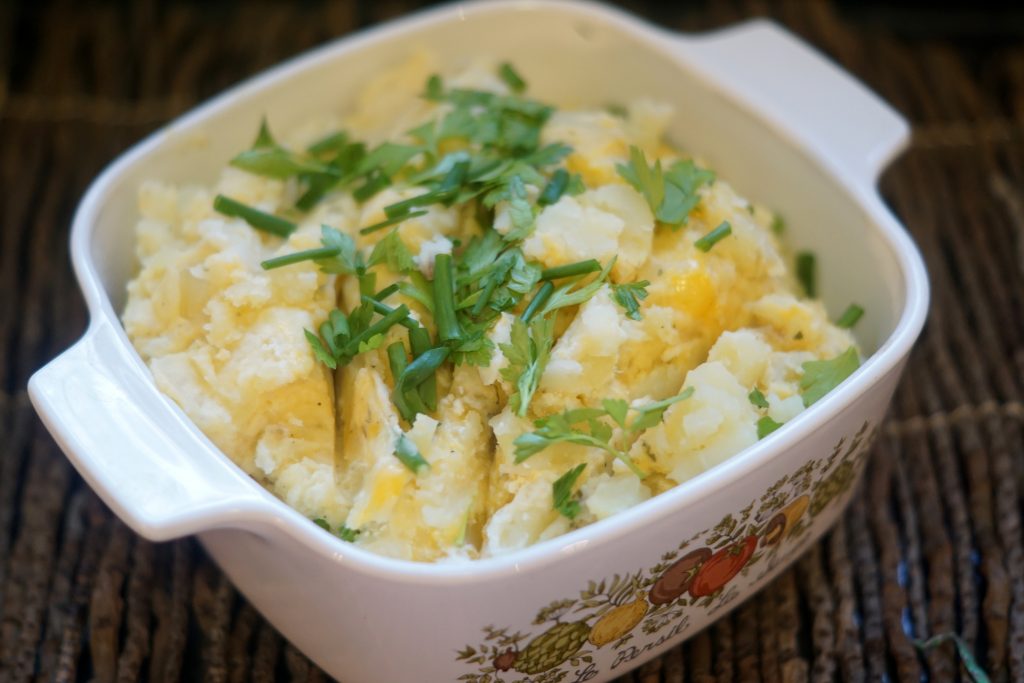 creamy herb garlic mashed potato in vintage Pyrex dish