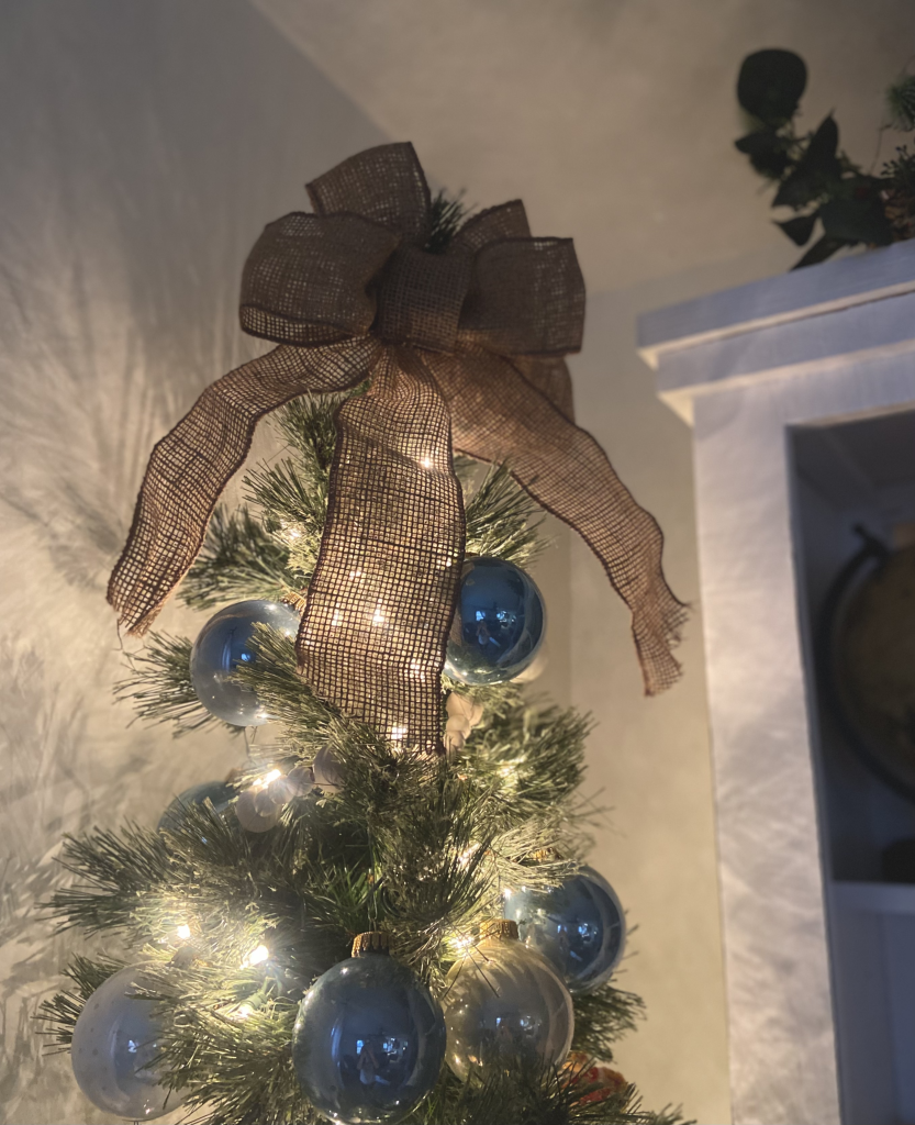 burlap bow on top of a Christmas Tree