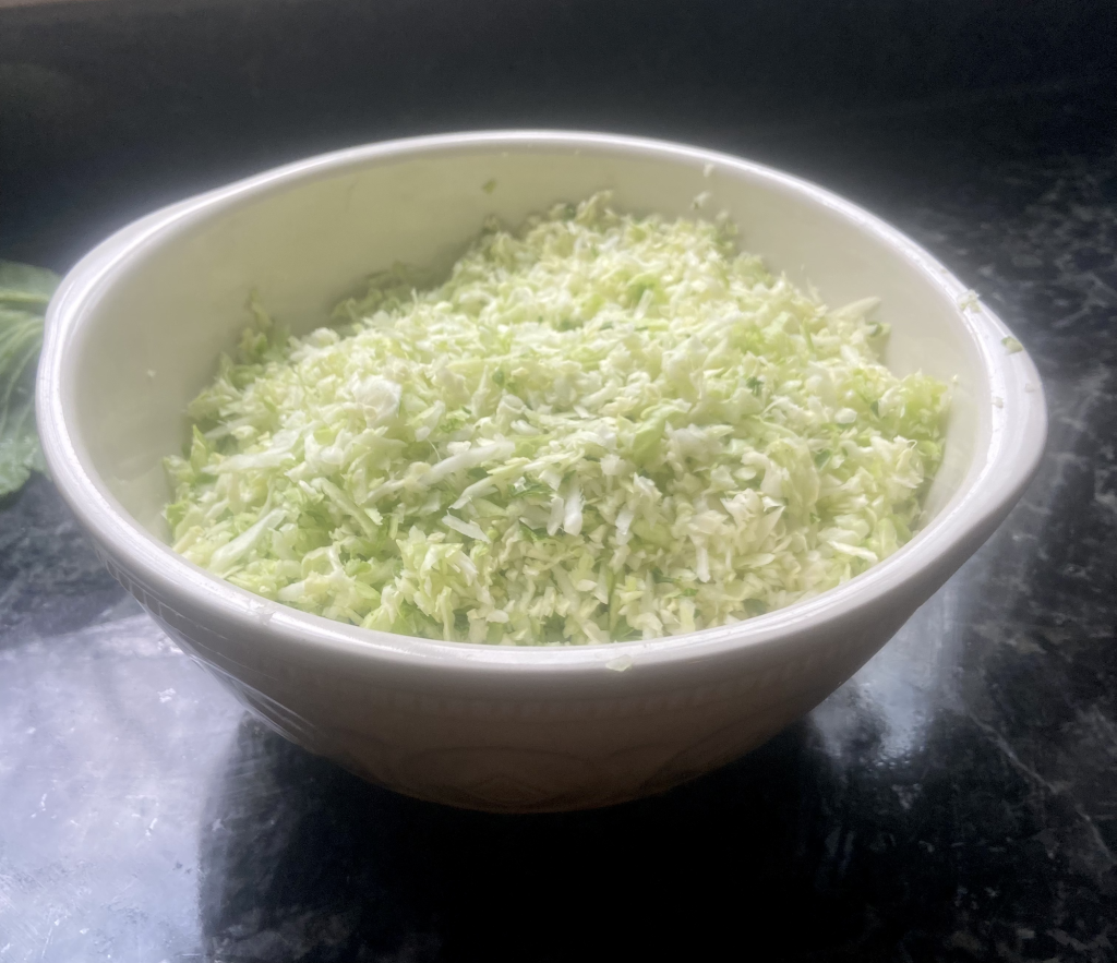 shredded cabbage in a mixing bowl