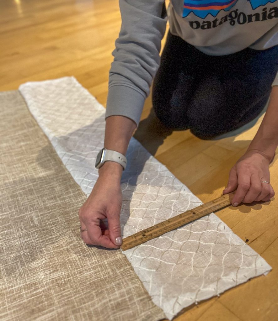 measuring curtain trim with a ruler