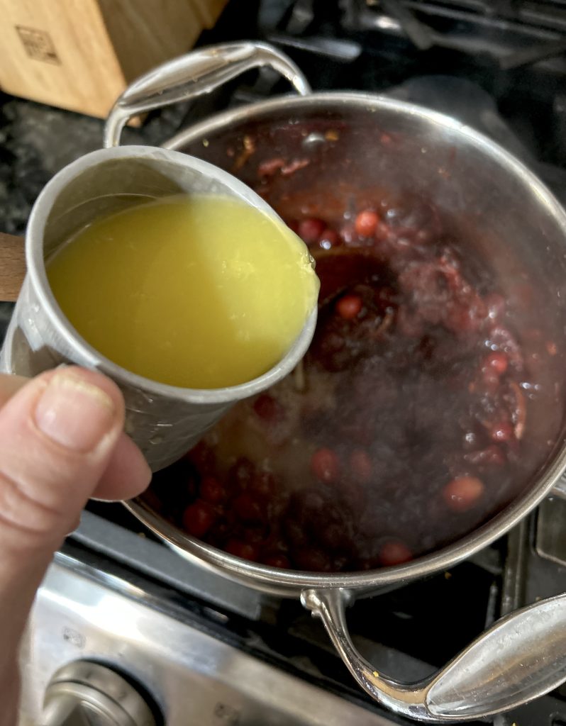 adding orange juice to Cranberry Sauce