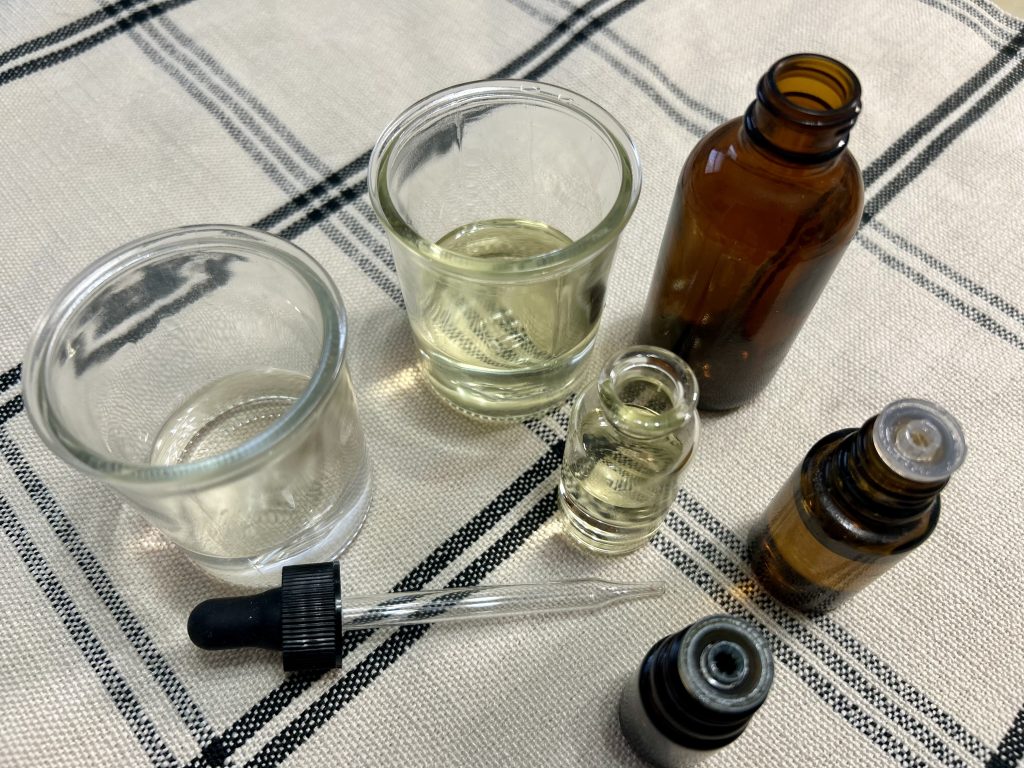 brown bottle, argan oil, witch hazel and essential oils