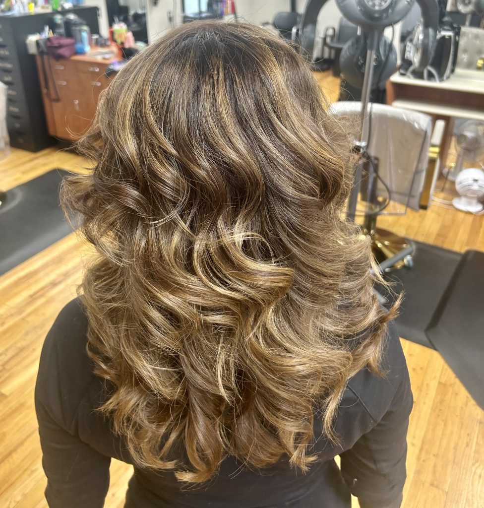 woman with thick black and caramel hair